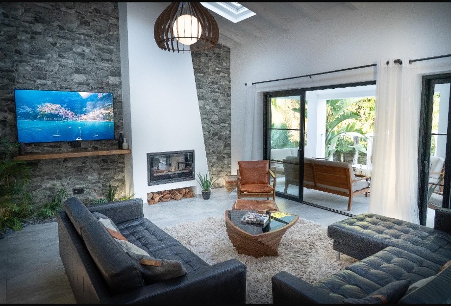 Villa V living room with stone wall